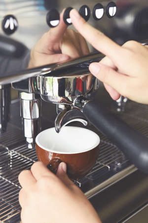 close up of coffee machine preparing cup of coffeeの写真素材