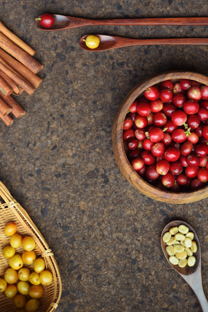 fresh coffee beans in wooden spoon with cinnamon for backgroundの写真素材