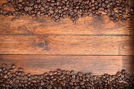 Close up of coffee beans on wooden backgroundの写真素材
