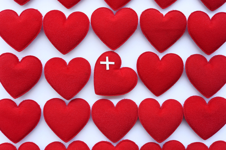 Red heart with stethoscope isolated on white backgroundの写真素材