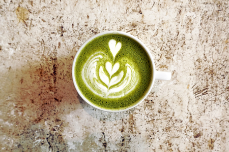 A cup of green tea matcha latte for background