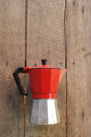 Retro zinc teapots on a wooden background.の写真素材