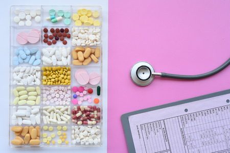 Different medication with stethoscope for background
