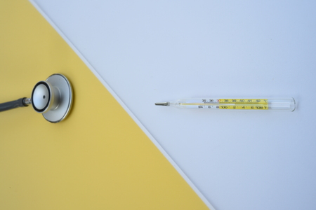 close up of stethoscope and thermometer for background