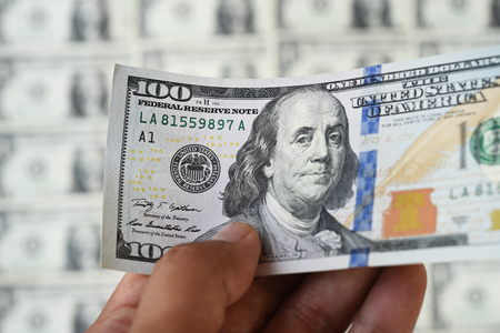 close up of banknote on hand for backgroundの写真素材