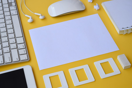 Top view of office desk table with keyboard, notebook, pencil and mouse for backgroundの写真素材