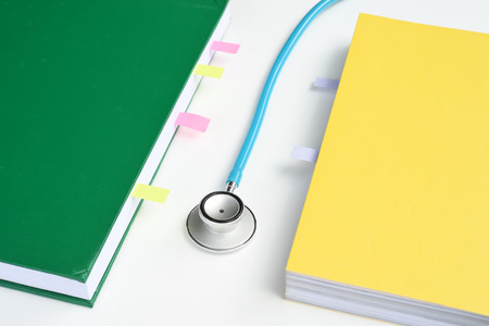 close up of stethoscope with notebook for backgroundの写真素材