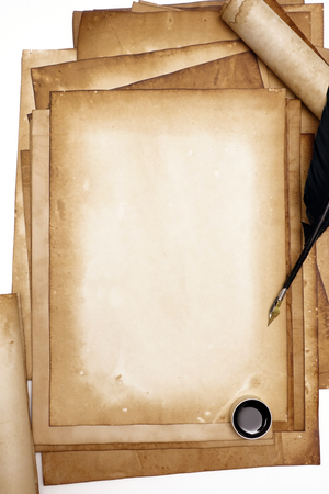 old paper on brown wood texture with feather and ink.の写真素材