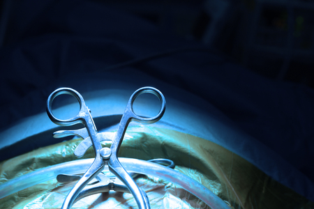 Veterinarian doctor in operation room for laparoscopic surgical take with art lighting and blue filterの写真素材