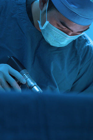 veterinarian surgery in operation room take with art lighting and blue filterの写真素材