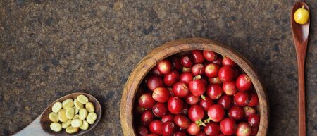 fresh coffee beans in wooden bowl on wooden backgroundの写真素材