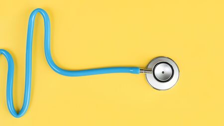 close up of stethoscope on yellow backgroundの写真素材