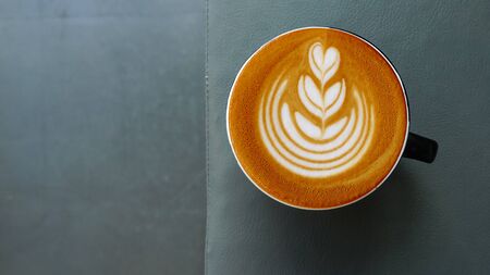 a cup of latte art coffee for background