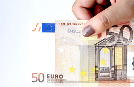 close up of banknote on hand isolated on white background