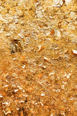 close up of buddha closed with gold plate