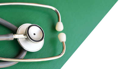 close up of stethoscope on green and white backgroundの写真素材