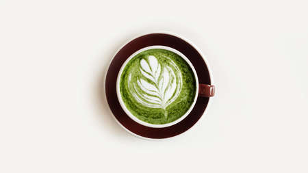 A cup of green tea matcha latte isolated on white backgroundの写真素材