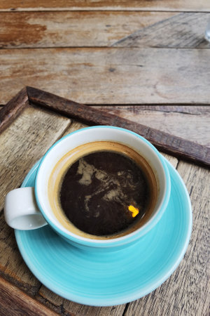 close up of a cup of coffee on wooden backgroundの写真素材