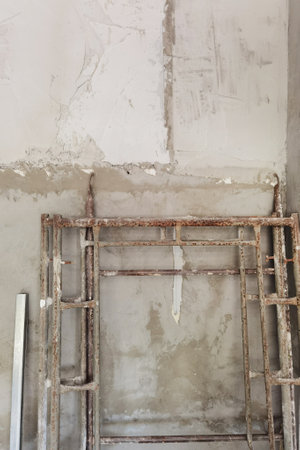 Construction tools on concrete wall for backgroundの写真素材