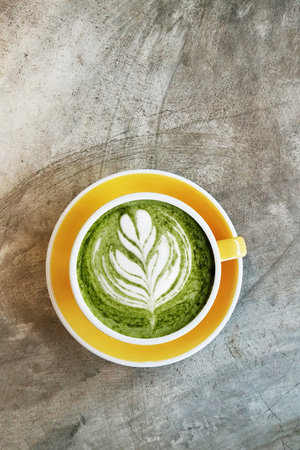 A cup of green tea matcha latte for backgroundの写真素材
