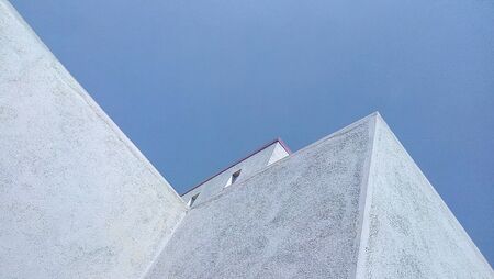 old minimalist building against clear blue sky
