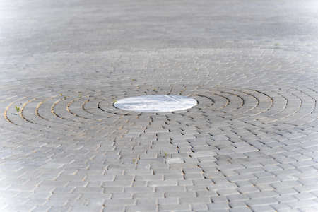 Paving a circle of stones as a durable and decorative coating, paving stones in a circle, background...