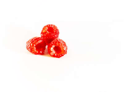 Raspberries, three berries, red, scarlet, ripe, close-up, horizontal, food and drinks, white backgroundの写真素材