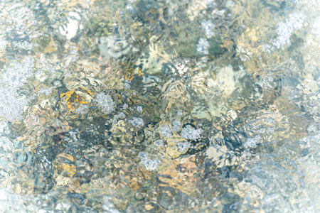 016_ Marine mosaic in the form of multi-colored pebbles in the water at a depth under water on a...