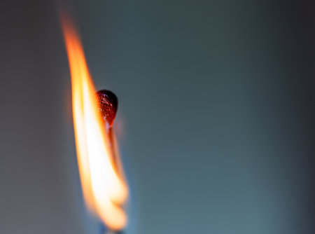 View of an ordinary wooden burning match with a sulfur head on a dark background, largeの写真素材