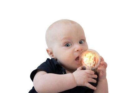Baby boy portrait and glowing light bulbの写真素材