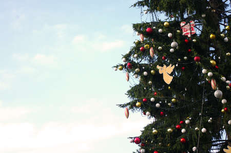 Colorful red and gold ornaments, decorations on Christmas tree banner,background. Copy space.の写真素材