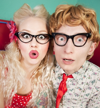 Funny surprised nerdy couple の写真素材