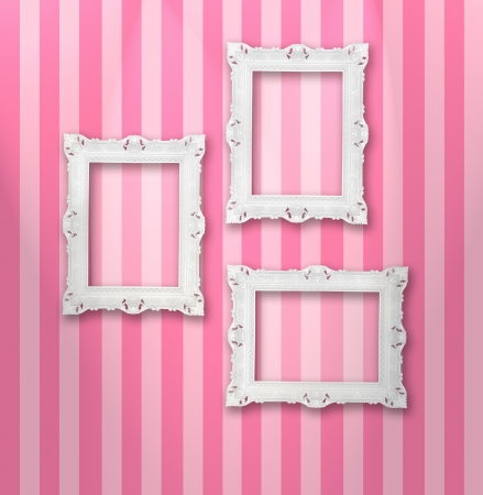 Set of white ornamental frames on a stripy wallpaperの写真素材