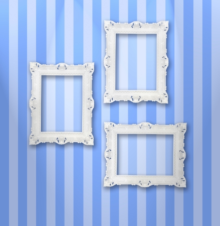Set of white ornamental frames on a stripy wallpaperの写真素材