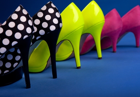 Colorful high heels on blue backgroundの写真素材
