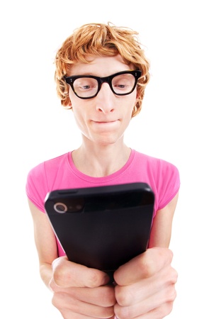 Funny guy concentrated while using smart phoneの写真素材