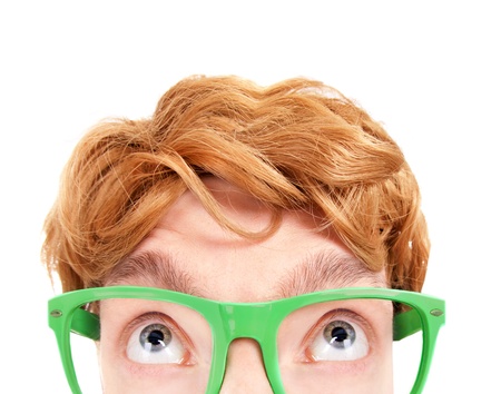 Funny nerdy guy looking up の写真素材