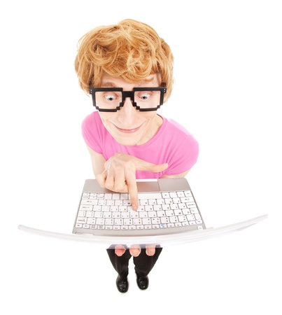 Funny nerdy guy with a laptop computer の写真素材