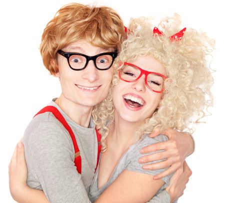 Happy nerdy couple embracingの写真素材