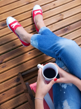 Woman relaxing on a patioの写真素材