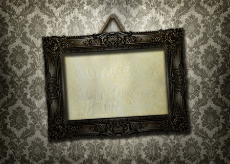 Beautiful ornate frame on a vintage wallpaperの写真素材