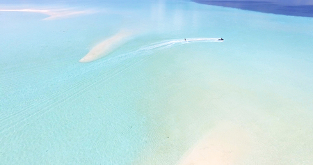 Maldives island Indian Ocean jet ski wakeboarding aerial top view.の写真素材