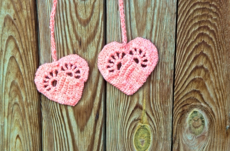 Two crocheted hearts as a symbol of loveの写真素材