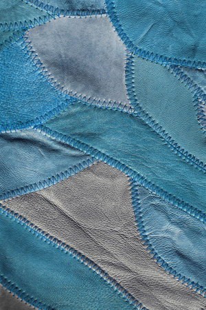 Blue patchwork background of genuine leather