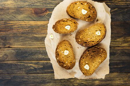 bread rusks on a wooden tableの写真素材