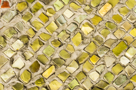 Colorful ceramic mosaic on the wall. Abstract background and texture for design.の写真素材