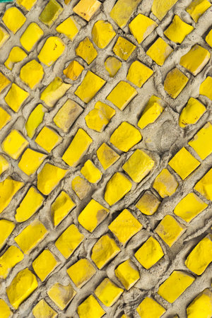 Close up detail of yellow ceramic tile wall texture. Abstract background and texture for design.の写真素材