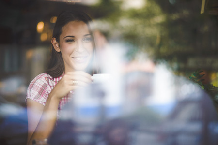 Young couple on first date drinking coffeeの写真素材