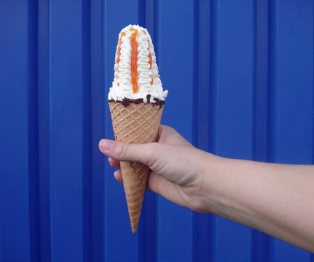 Delicious white ice cream on a blue background