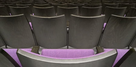 Empty rows of seats in hall.Concept of corona quarantine,cancel of mass events